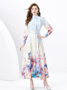 Overlaid with a cascade of blue florals, this dress exudes the carefree essence of a sun-drenched meadow. The design features a flattering, tailored bodice that smoothly transitions into a soft, A-line skirt. Pops of white amidst the blue create a stunning contrast, resembling the first blooms after a spring rain. The lightweight fabric offers comfort and breathability, perfect for those balmy days, while the capped sleeves add a touch of modesty. Accented with a round, buckled belt that cinches Spring Rain, Blue Florals, Long Sleeve Print Dress, Floral Fashion, Xl Dress, Piece Of Clothing, Cap Sleeves, A Line Skirts, Belt Buckles