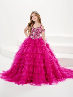 Your sweet girl will love twirling around in this bead embroidered long cold shoulder dress with A-line ruffled tulle skirt by Tiffany Princess 13753. This cold shoulder gown features a V-neckline with beaded embellishments, floor length A-line tulle skirt with tiered ruffles, sweep train, and a lace-up back. House of Wu Tiffany Princess Collection Spring 2024 Style Number: 13753 Fabric: Beading/Tulle Please note: There may be a loss of glitter while wearing this dress due to the nature of the f Fabric Beading, Back House, Prom Dress Shop, Cold Shoulder Gown, Beaded Embellishments, Best Designer Dresses, Fancy Dress Up, Best Prom Dresses, Formal Wear Dresses