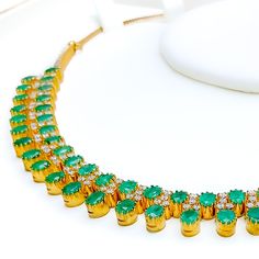 This exquisite 18k yellow gold necklace set, weighing 41.8 grams, features a luxurious design adorned with dazzling diamonds and vibrant emeralds. The yellow gold finish enhances its elegant appeal, making it perfect for any special occasion. The set includes a necklace with a total diamond weight of 2.95 carats, featuring F-G color and VS quality diamonds. The necklace has a length of 15 inches with adjustable 1.1-inch links and is secured with a hook lock. The matching earrings, each measuring Luxury Hand Set Round Emerald Necklace, Luxury Hand-set Round Emerald Necklace, Gold Plated Emerald Necklace For Formal Events, Elegant Hand-set Emerald Necklace In Yellow Gold, Elegant Yellow Gold Hand Set Emerald Necklace, Formal Gold Plated Emerald Necklace, Formal Gold-plated Emerald Necklace, Dazzling Gold Emerald Necklace, Dazzling Gold Emerald Necklace As Gift