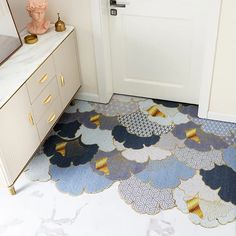 a blue and white rug in front of a door with an ice cream cone pattern on it