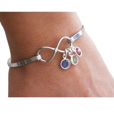 The dainty, personalized infinity bangle with Swarovski birthstones and engraved heart charm (optional) makes a beautiful gift for mothers, grandmothers and great grandmothers.  COMPONENTS ❤ tiny silver plated Swarovski crystal birthstones  ❤ optional: add a small stainless steel heart (approx. 1/2") engraved with up to 7 characters max.  ❤ solid stainless steel adult size infinity bangle is available in 2 different sizes: small/medium suitable for small to medium women's size wrists of up to 7" Adjustable Customizable Sterling Silver Jewelry, Adjustable Jewelry As Personalized May Birthstone Gift, Adjustable May Birthstone Jewelry For Personalized Gifts, Customizable Adjustable Jewelry, Adjustable Jewelry For May Birthstone Personalized Gift, Adjustable Custom Name Jewelry For Birthday Gift, Adjustable Custom Name Jewelry For Birthday, Adjustable Bangle Jewelry For Birthday, Customizable Adjustable Silver Jewelry