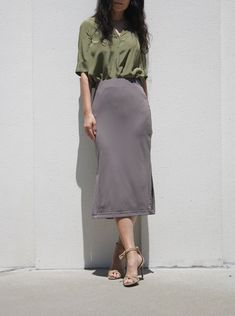 "With a softly knit finish, this charming gray brown midi skirt with splits delivers effortless elegance and flair Tone down gray with of brown shade is simply chic Straight midi skirt drops below knee with side splits Mix and match colors for set -Slim fit -Elasticised waist -Drops mid calf -Side splits on both sides -Made of soft and stretch rayon knit jersey Is your measurements off sizes? Please ask us about custom skirt There will be additional charge for custom order. Please inquire via me Relaxed Fit Solid Midi Pencil Skirt, Relaxed Midi-length Pencil Skirt, Versatile Solid Midi Skirt, Gray Relaxed Fit Lined Maxi Skirt, Gray Relaxed Maxi Skirt With Lined Skirt, Gray Relaxed Fit Maxi Skirt With Lining, Gray Relaxed Maxi Skirt With Lining, Spring Gray Midi-length Skirt, Gray Midi Length Skirt For Spring