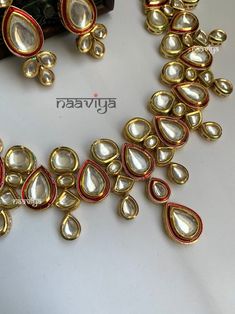 Product Description: * Kundan Necklace Set/ Red Kundan Set Traditional Jewelry Set/ Sabyasachi Jewelry Set/ Kundan Earrings/ Kundan mangtika Gold Necklace Set * The base metal color is Gold tone studded with kundan along with beads work on it. * This Jewelry set would add more charms to your beautiful jewelry collection and would surely bring lots of compliments . * Note:- This is an artificial Jewelry Set. * Care Instructions: Keep it dust-free & dirt free in a plastic pouch. Remember to apply Red Tikka With Latkans For Festive Occasions, Festive Red Tikka With Latkans, Red Latkans Tikka For Festive Occasions, Red Temple Jewelry Tikka For Festive Occasions, Red Bollywood Kundan Necklace For Party, Red Bollywood Style Kundan Necklace For Party, Red Latkans Necklace For Party, Festive Red Meenakari Tikka, Festive Red Cutdana Tikka