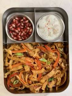 a metal tray filled with different types of food