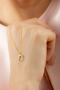 Dainty Gold Diamond Minimalist Heart Necklace Pendant, 14k Gold Diamond Necklace, Tiny Heart Love Necklace Valentines Day Gift for Her  FEATURES• Solid Gold (real gold, not gold plated or gold filled material)• Gold Karat: 10K (417) - 14K (585) - 18K (750) (optional)• Pendant Height: 0.44 Inches (1.12 cm)• Pendant Width: 0.38 Inches (0.96 cm)• Available Gold Color: Yellow gold, rose gold and white gold (optional)• Diamond weight: 0.015 ct• Diamond color: G-H Color• Diamond clarity: SI• Necklace Delicate Yellow Gold Heart Pendant Necklace, Delicate 14k Yellow Gold Heart Necklace, Delicate Yellow Gold Sterling Silver Heart Necklace, 14k Yellow Gold Heart Necklace With Delicate Chain, 14k Gold Heart Cut Necklace For Her, Yellow Gold Heart Pendant Necklace For Her, Yellow Gold Open Heart Necklace Gift For Her, Yellow Gold Open Heart Necklace For Her, Delicate Yellow Gold Heart Necklace For Everyday