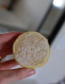 a person holding a small piece of food in their hand