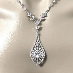 Glam statement bridal necklace featuring glamorous 1920s Art Deco Gatsby Downton Abbey vintage style geometric sunrise sunshine rays ornate details made of sparkly clear cubic zirconia set on tarnish-resistant silver rhodium plated base. Necklace length is adjustable from 17" (43cm) to 19" (48cm) .  Matching pieces at https://etsy.me/2w9kxYn   ~ Shipping to USA is a flat rate. You save by paying only 1 fee for multiple items in combined shipping. ~ Policies https://www.etsy.com/shop/yjdesign#pol Art Deco Crystal Necklace For Wedding, Flapper Wedding, Necklace Art Deco, 1920s Vintage, Necklace Art, Deco Wedding, 1920s Art, 1920s Art Deco, Art Deco Wedding