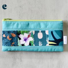 Keep your writing utensils organized in style with our Medium Aqua Taro Patchwork Pencil Cases. The slim zippered pouch features a playful patchwork accent in vibrant colors. Perfect for adding a fun touch to your everyday routine! This listing is updated regularly with available pencil cases. Shown pencil case is a sample only. Patchwork print pattern will be the same, zipper colors may vary. No two pencil cases are the same. Product Details Cotton, linen cotton 8" wide x 4" tall Interfaced for Green Zipper Pouch Stationery, Green Zipper Pouch Stationery For Daily Use, Multicolor Stationery Pouch For Daily Use, Green Pencil Case Pouch With Pen Holders, Multicolor Rectangular Pencil Case For Everyday Use, Green Rectangular Pencil Case With Pen Slots, Green Pencil Shaped Case With Zipper Closure, Multicolor Pencil Case With Zipper Closure, Multicolor Pencil Case With Zipper Closure For Organization