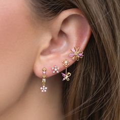 Delicate pink florals paired with fluttering butterflies add a touch of magic to your everyday look. You'll get lost in the stunning and calming baby pink hues of the cubic zirconia stones. Light Pink Jewelry Set, Rose Gold Cubic Zirconia Flower Earrings, Feminine Flower Charm Earrings, Pink Whimsical Flower Earrings For Pierced Ears, Pink Whimsical Flower Earrings With Flower Charm, Whimsical Pink Earrings With Flower Charm, Whimsical Pink Flower Earrings For Pierced Ears, Pink Whimsical Flower Charm Earrings, Elegant Pink Jewelry With 3d Flowers