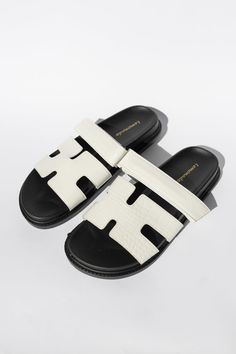 #color_white Adjustable White Leather Slides, White Leather Sandals With Textured Footbed, White Casual Slides With Single Toe Strap, White Adjustable Slides With Textured Footbed, Adjustable White Slides With Textured Footbed, White Leather Sole Slip-on Slides, White Adjustable Leather Sandals, Adjustable White Leather Sandals, Modern Adjustable Leather Slides