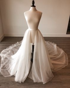 This 5 layer soft tulle wedding over skirt is designed for the most memorable moments of your life which is your wedding day!  Our detachable skirt is 2 meters long and can be added to any of our bridal dresses. This soft beautiful tulle full-length over skirt provide both stylish and extremely classy finishing touch that suits most bridal looks.  They come in our traditional ivory (off-white) colour as well as white, black and champagne.  Size  2 meters long / 200 cm  Shipping  Standard processing time is 3-7 days Domestic shipping: Up to 28 days. International Shipping: Up to 36 days.  If you need express shipping, please message us for the fastest shipping option.  Happy shopping xoxo Wedding Dress With Sweep Train, Prom Tulle Long Skirt Bottoms, Party Wedding Dress With Tulle Skirt And Organza, Elegant Tulle Skirt For Debutante Ball, Tulle Wedding Dress With Detachable Train, Tulle Wedding Dress With Detachable Train For Bride, Elegant Tulle Skirt For Wedding, White Organza Wedding Skirt, Elegant Organza Petticoat With Tulle Skirt