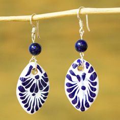 These pretty dangle earrings are the original design of Monica Vazquez in Mexico. The artisan combines hand-painted Talavera-style ceramic beads from Puebla with lapis lazuli beads for a beautiful combination of blues. The earrings swing from sterling silver hooks. Artisan Blue Earrings, Artisan Blue Earrings With Dangling Beads, Artisan Blue Hand Painted Jewelry, Artisan Blue Jewelry With Fair Trade, Painted Clay Earrings, Talavera Earrings, Porcelain Aesthetic, Mason Stains, Pretty Dangle Earrings