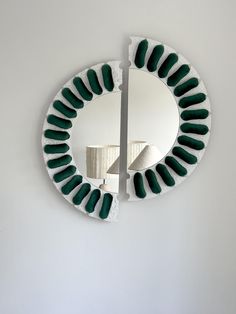 a mirror that is on the side of a wall