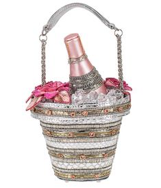 Pop bottles and tags with this party ready handbag from Mary Frances. The handbag's champagne bucket, bottle, and glasses are all hand beaded and finished with life-like resin, ice rocks. Outfitted with an inner pocket, beaded top handle, and a magnetic flap closure.This is a Special Order item, please allow a 6-8 week handling time.This is a handmade item, each one an individual work of art. Slight variations may occur.Available while supplies last. Champagne On Ice, Ice Rock, Event Shoes, Champagne Bucket, Mary Frances, Champagne Buckets, Timeless Classic Style, Beaded Handbag, Top Handle Handbags