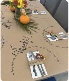 the table is set with place settings for two people to sit at and have their name written on it