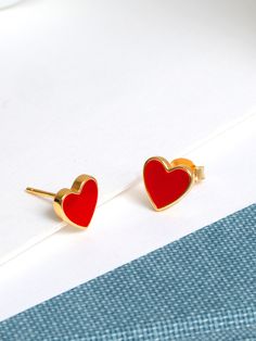 Love heart enamel studs in a vibrant red colour.  Hand crafted from 18 Karat gold vermeil, plated over solid sterling silver with an on trend enamel finish.   These are the perfect feel-good earrings, plus they make a meaningful yet fun gift!  These pretty studs  look perfect mixed and matched, and paired with other studs hoops from our range. Sold in pairs.  Other earrings worn in the photos -  Palm tree studs & Gemstone Studded Palm Tree Studs. Please see the link below to view other items in our range: https://www.etsy.com/uk/shop/12CasaCala PACKAGING These earrings arrive in in our branded holographic jewellery pouch.  To make a perfect gift, why not upgrade to a gift box with gift wrapping and a handwritten message card of your choice! CARE INFO These earrings can be worn everyday, st Glossy Enamel Jewelry Gift, Gold Enamel Heart Charm Earrings, Red Enamel Jewelry For Anniversary, Double Heart Enamel Jewelry For Gifts, Valentine's Day Gold Heart Enamel Earrings, Gold Enamel Heart Earrings, Valentine's Day Gift Earrings With Polished Finish, Gold Enamel Heart Earrings For Valentine's Day, Red Enamel Jewelry For Valentine's Day