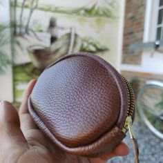 Ideal for quick trips or outdoor activity, our Zip Leather Coin Purse is for those who like to keep things simple and only need to carry the essentials. Handmade by leather artisans on Lake Atitlan, the zip coin purse is constructed with a golden YKK zipper attached with a hand-stitched leather puller to facilitate opening. The full-grain pebbled black leather develops a smooth, much-desired patina with use. Specs Length: 4.5´´ Height: 3.5´´ Depth: 1.0''Material: Full-grain bovine leather Brown Wallet With Zipper Pouch, Brown Coin Purse With Zipper Closure As Gift, Brown Leather Coin Purse With Zipper Closure, Brown Pouch With Zipper Pocket As Gift, Brown Pouch With Zipper Pocket For Gift, Leather Coin Purse With Zipper For Everyday Use, Everyday Leather Coin Purse With Zipper, Leather Coin Purse With Zipper Closure For Everyday Use, Gift Brown Pouch With Zipper Pocket