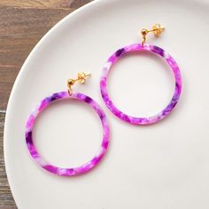 These colorful purple earrings carry a super fun boho vibe. They are cute and so comfortable to wear as they are very lightweight and of course hypoallergenic! Plus they are eco-friendly, as they are made from biodegradable material :) ♡ Materials info The circle pendants are cellulose acetate, while the gold-colored stainless steel ball posts and backs are hypoallergenic to keep sensitive skin happy.   ♡ Packaging info Each earring set will come beautifully packaged in a gift box, ready for gif Trendy Purple Earrings For Everyday Wear, Trendy Purple Drop Earrings, Trendy Hypoallergenic Purple Earrings, Trendy Handmade Purple Earrings, Trendy Purple Plastic Jewelry, Trendy Purple Round Earrings, Happy Packaging, Earrings Colorful, Purple Earrings