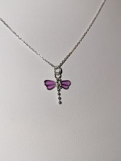 This handmade "Annabelle" design is made with beautiful clear & purple enamel and crystals forming an elegant dragonfly on a 18-20" adjustable Gossamer Diamond Cut 1mm Sterling Silver necklace. This beautiful necklace brings out the transformation, realization, creative imagination, and insight of clear vision dragonflies can represent. This sparkling crystal dragonfly necklace looks great on the job, every day, or out on the town. Each piece has a beautiful design name, inspired to bring out th Purple Jewelry With Adjustable Chain As Gift, Purple Jewelry With Adjustable Chain For Gift, Adjustable Personalized Purple Necklace, Elegant Adjustable Dragonfly Necklace, Adjustable Purple Necklace For Gifts, Adjustable Purple Necklace For Gift, Hypoallergenic Lavender Jewelry For Gifts, Adjustable Dragonfly Jewelry With Lobster Clasp, Adjustable Dragonfly Necklace For Gift