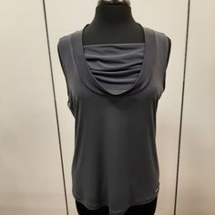 Calvin Klein Dark Grey Dress Top With Gently Gathered Inset At Chest Area. Approximate Measurements - Pit To Pit - 19-1/2 Inches Length - 23 Inches 744-61824 Calvin Klein Stretch Tank Top, Calvin Klein Fitted Sleeveless Tank Top, Elegant Sleeveless Gray Tops, Casual Sleeveless Tank Top By Calvin Klein, Calvin Klein Casual Sleeveless Tank Top, Casual Calvin Klein Sleeveless Tank Top, Elegant Sleeveless Calvin Klein Tops, Casual Stretch Calvin Klein Tank Top, White Floral Top