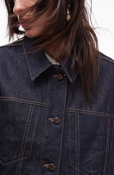 A boxy silhouette and indigo-dyed denim refresh the classic design of an all-cotton trucker jacket that adds the perfect finishing layer to your look. 24" length (size Medium) Front button closure Spread collar Button cuffs Chest on-seam pockets; front welt pockets 100% cotton Machine wash, line dry Made in Turkey Spring Dark Wash Rigid Denim Jacket, Spring Rigid Denim Jacket With Patch Pockets, Relaxed Fit Dark Wash Rigid Denim Jacket, Relaxed Fit Rigid Denim Jacket For Fall, Relaxed Fit Dark Wash Denim Jacket, Recycled Denim Jacket For Spring, Indigo Denim Top For Fall, Classic Indigo Denim Jacket, Recycled Denim Relaxed Fit Jacket For Fall