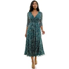 Unveil your inner radiance in the Harlow & Rose Faux Wrap Maxi Dress. This flowing silhouette, crafted from a breezy summer mesh, flatters every curve with a self-belting waist that cinches your figure for a romantic look. Imagine strolling hand-in-hand on a date night or leaving a lasting impression at a special celebration. The all-over print and chic ruching at the cuffs add a touch of femininity, perfect for unforgettable moments. Whether it's work, an anniversary, birthday, wedding, or a ca Teal Outfits, Flowy Summer Dresses, Blue Party Dress, Chiffon Evening Dresses, Wrap Maxi Dress, Short Sleeve Maxi Dresses, Flowy Maxi Dress, Boho Floral Dress, Strapless Maxi Dress