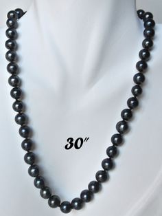 "PREMIUM ROUND 9-9.5mm BLACK PEARL NECKLACE Elegant Round shaped black cultured freshwater pearl necklace; Handpicked by experienced jewelers for their luster, color and cleanliness; Available in other pearl sizes (6mm to 12mm) and other colors (white, peach). EXQUISITE CRAFTSMANSHIP Carefully double knotted between each pearl; Finished with sturdy rose-shaped clasps; This fine pearl jewelry is a symbol of wisdom and is believed to offer protection and attracts good luck and wealth. LUXURY JEWEL Classic Tahitian Pearl Jewelry With Round Beads, Classic Tahitian Pearl Necklace For Anniversary, Single Strand Tahitian Pearl Jewelry With Round Beads, Formal Black Tahitian Pearl Jewelry, Elegant 8mm Beads Jewelry For Anniversary, Black Tahitian Pearl Single Strand Jewelry, Black Tahitian Pearl Jewelry For Anniversary, Anniversary Black Tahitian Pearl Jewelry, Classic Jewelry With 8mm Round Beads