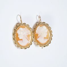 Condition: Excellent, Pre-owned. The Perfect Pair. 14 karat yellow gold Cameo earrings. Hook back closure. The Perfect Go-To Earring! Metal: Yellow Gold - Purity 14 KaratFinish: PolishedGem/Organics: ShellGem Measurements: 21.05 x 16.06 mm CoralEarring length: 34.00 mm x 19.40 mm &/or 1.35" x 0.77" Marks: No markingsWeight: 7.64 grams, 0.269 ounces Condition: Very Good, Pre-Owned Origin: N/A Classic Intaglio Earrings For Formal Events, Classic Intaglio Earrings For Formal Occasions, Elegant Carved Earrings For Formal Occasions, Victorian Cameo Yellow Gold Earrings, Formal Cameo Yellow Gold Earrings, Formal Yellow Gold Cameo Earrings, Gold Cameo Round Earrings, Carved Yellow Gold Earrings For Formal Occasions, Victorian Cameo Earrings For Formal Occasions