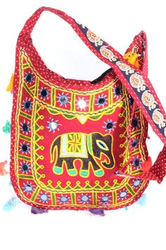 Bright and vibrant sling purse good for a day of shopping or vacationing! The mirror work multi color Jhola purse with tassels is handmade from 100% cotton,especially convenient to store your personal items and these unique colorful purses pair beautifully with casual jeans and light flowing tops or sun dresses. Also has inner pocket and zip top enclosure. *Height:14 inches Width: 14 inches Fabric: 100% cotton Hand made item, may have a slight variation in size Traditional Cotton Shoulder Bag For Daily Use, Trendy Multicolor Cotton Shoulder Bag, Traditional Multicolor Cotton Bag, Red Bohemian Cotton Bags, Bohemian Red Cotton Bags, Traditional Cotton Festival Bag, Festival Cotton Tote Shoulder Bag, Multicolor Hippie Shoulder Bag For Festivals, Red Bohemian Cotton Shoulder Bag