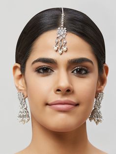 NAZRANAA JEWELS OFFERS A GREAT RANGE OF INDIAN JEWELRY FOR TODAY'S WOMAN WITH THE LATEST DESIGNS. THE BRAND IS COMMITTED TO PROVIDING ITS CUSTOMERS WITH THE HIGHEST QUALITY OF GOODS AND NEWEST DESIGNS. IT IS SUITED FOR A WOMAN WHO IS LOOKING TO STAY DATED WITH THE LATEST TRENDS. RADIANT ANTIQUE GOLD EARRINGS WITH MAANG TIKKA IS A PERFECT ACCESSORY FOR ANY NIGHT EVENT. IT IS SURE TO MAKE YOU STAND OUT IN A CROWDED ROOM. Traditional Indian Jewelry: Slight Color variations possible due to differenc Indian Gold Earrings, Tikka Indian Jewelry, Crowded Room, Gold Jhumka, Antique Gold Earrings, Gold Jhumka Earrings, Traditional Indian Jewellery, Maang Tikka, Color Accents