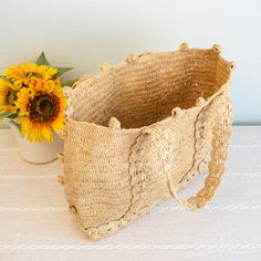 Bohemian Straw Shoulder Bag With Braided Handles, Bohemian Straw Tote Shoulder Bag, Bohemian Straw Shoulder Bag, Bohemian Bucket Shoulder Bag In Straw, Bohemian Shoulder Bag With Braided Handles In Natural Color, Bohemian Straw Bag With Open Weave, Artisan Straw Bag With Open Weave, Bohemian Straw Crochet Bucket Bag, Artisan Straw Bag With Open Weave Design