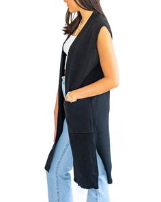 Elevate your style with the Nior Sweater Vest. This sleeveless, long vest in classic black adds a touch of effortless sophistication to any outfit. Stay warm and fashionable all year round with this timeless piece. Hannah is 5'9" wearing a size small/medium. Long Vest, Jumpsuit Outfit, Long Vests, Midi Maxi Dress, Dress Romper, Clothes Gift, Elevate Your Style, Hat Hairstyles, Sweater Vest