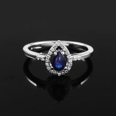 Description   :  Vintage  Blue Sapphire  Gemstone Ring, 925 Sterling Silver Ring, Statement Ring, Stacking Ring, Silver Ring, Blue Stone Ring, Designer Ring| Vibrant And Unique Gemstone Give This Ring An Eye Catching Allure | This Ring Will Provide A Perfect Sense Of Elegance To Your Beauty | Product Type   :    Statement Ring Stone   :      Blue Sapphire Second Stone      :    CZ Zircon Metal   :   925 Sterling Silver Materials   : Silver And Natural Gemstone    Stone Size   :   6X4 MM      Stone Shape   :    Pear Total Weight    :     2.40 G     We Also Provide Different Size & Different Type Of Stone In Our Jewelry When You Start Wearing A Piece Of My Jewelry You Will Fall In Love With It More And More Each Day  And Feel That Good Energy And Love That I Pass Into It While Creating This Teardrop Sapphire White Gold Rings, White Gold Sapphire Teardrop Rings, Blue Topaz Teardrop Ring Fine Jewelry, Blue Teardrop Halo Setting Ring, Blue Sterling Silver Cluster Ring With Halo Setting, Sapphire Diamond Teardrop Rings, Blue Sterling Silver Diamond Promise Ring, Blue Cluster Ring With Halo Setting In Sterling Silver, Sapphire Crystal Ring With Halo Setting For Promise