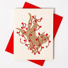 a card with an image of a cat on it's back and red dots around the tail