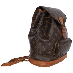 Authentic, pre-owned Louis Vuitton Brown Monogram Montsouris Backpack Mm (Medium size). Features monogram canvas with leather trim, front zippered pouch, top string closure with buckle front flap, the interior has a brown textile lining with slip pocket, adjustable shoulder straps. This bag is perfect for shopping, travel, school, and hands-free needs. Unisex bag! Authenticity Date Code: SP0024 Made in France Strap Drop: (adjustable) Montsouris Backpack, Pre Owned Louis Vuitton, Louis Vuitton Brown, Zippered Pouch, Bag Packaging, Monogram Canvas, Zipper Pouch, Leather Trims, Front Zipper