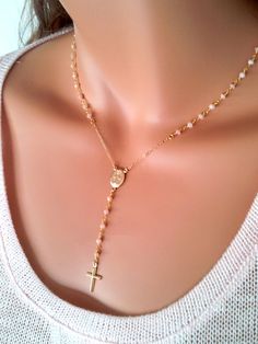 "This is a gorgeous rosary necklace with Genuine Peruvian Pink Opals on 14kt gold filled chain. A gold filled miraculous medallion sits at center of this lovely necklace. A simple and delicate 15mm gold filled cross hangs from the 2 1/2\" drop. Necklace may be ordered in a 16\", 18\", 20\" 22\" or 24\" length around the neck. (Priced accordingly, you choose size) Has spring closer clasp in back. Comes beautifully boxed, the perfect gift! All my jewelry is handmade and made to order. This necklac Gold Rosary As A Gift, Gold Spiritual Rosary With Miraculous Medal, Yellow Gold Rosary With Miraculous Medal As Gift, Handmade Gold Jewelry For First Communion, Gold Crucifix Necklace With Miraculous Medal, Gold Jewelry With Miraculous Medal For First Communion, Gold Miraculous Medal Jewelry For First Communion, Dainty Gold Jewelry For First Communion, 14kt Gold Jewelry