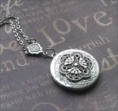 Silver Locket Necklace, Celtic Jewelry, Photo Picture Locket, Locket For Her, Celtic Wedding, Trinity Necklace, Mother of Three, Locket Gift This enchanted necklace features a beautiful locket adorned with an ornate silver filigree cabochon and rosary style connector. The chain measures 18 inches long and is secured with a lobster clasp. The locket is 1 and 1/4 inches tall and has space for two photos or anything else you choose to put inside. All plated in silver with an oxidized finish. Very h Metal Medallion Jewelry For Wedding, Metal Locket Necklace For Wedding, Antique Silver Victorian Jewelry For Wedding, Handmade Medallion Jewelry For Wedding, Victorian Bracelet Jewelry For Wedding, Victorian Silver Jewelry With Adjustable Chain, Victorian Style Bracelet Jewelry For Wedding, Adjustable Vintage Charm Wedding Jewelry, Victorian Silver Jewelry For Marriage