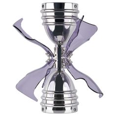 a silver and purple glass vase on a white background with the top part of it being blown