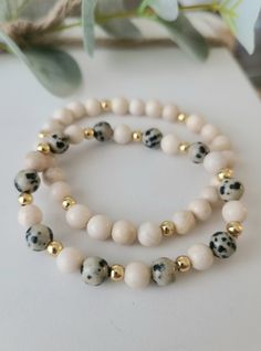 "▪️This custom beaded bracelet set includes: - 2 Dalmatian Jasper (Cheetah), Riverstone Fossil and Gold Filled bead bracelets. This leopard bracelet stack is gorgeous and literally matches everything! This neutral stack is timeless, classy and perfect for that minimalist look. ▪️These 6mm beads are hand strung on professional grade stretch cord. The tiny gold-filled gold beads are 4mm. They are beautiful, chic and are perfect for layering and stacking! 8mm bracelets COMING SOON Bracelet Sizing ⬇ Luxury Modern Beaded Bracelets With Round Beads, Leopard Bracelet, Stretchy Beaded Bracelet, Clay Bracelet, Dalmatian Jasper, Diy Bracelet Designs, Beads Bracelet Design, Crystal Beads Bracelet, Beaded Bracelets Diy