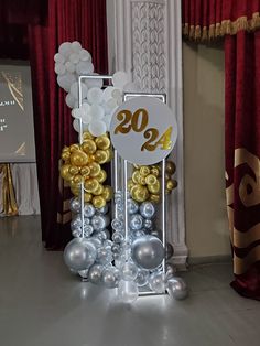 a table with balloons and decorations on it