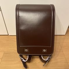 Randoseru : This randoseru made by Tsuchiya Bag company Which is one of the best randoseru maker in Japan. Its made by high quality Cowhide.  Item: Cowhide Leather school Bag / Japanese Randoseru - Brown & Purple No.rnd011 Condition: Used/ Good. Please check the listing pictures. Size: Adult Wearable You could put your laptop without any ploblem. Tsuchiya Bag Company / Made in Japan Tsuchiya bag is one of the best randoseru maker in Japan. https://fujiyamarock.etsy.com Shipping Japan Post takes Practical Satchel Shoulder Bag For School, Practical Rectangular Shoulder Bag For School, Practical School Satchel Shoulder Bag, Brown Rectangular Shoulder Bag For Students, Brown Student Backpack, Brown Leather Backpack For Students, Functional Rectangular Leather Backpack For School, Leather School Backpack With Luggage Sleeve, Brown Standard Backpack For Back To School