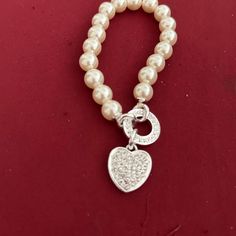 Gloria Pearlesque Heart Charm Bracelet Elegant White Charm Bracelet With Heart Charm, Elegant White Pearl Bracelet With Heart Charm, Elegant White Bracelet With Heart Charm, Elegant White Heart Charm Bracelet, Elegant White Heart Bracelet For Party, Elegant White Pearl Bracelet For Valentine's Day, Elegant White Heart Bracelet For Valentine's Day, Avon Jewelry, Vintage Avon