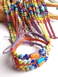 Colorful Beaded Bohemian Friendship Bracelets, Bohemian Beaded Colorful Friendship Bracelets, Multicolor Bohemian Beaded Bracelets For Festivals, Bohemian Multicolor Beaded Bracelets For Festivals, Colorful Beads Friendship Bracelets For Festivals, Hand-strung Multicolor Friendship Bracelets For Festivals, Multicolor Hand-strung Friendship Bracelets For Festivals, Colorful Adjustable Hand-strung Beaded Bracelets, Bohemian Multicolor Braided Bracelets With Colorful Beads