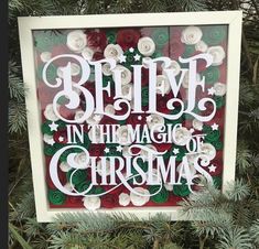 a christmas ornament hanging from a tree with the words believe in the magic of christmas