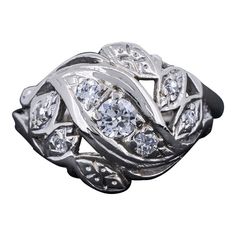 a silver ring with diamonds on it