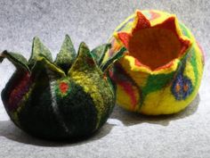 two small objects made out of felt sitting next to each other