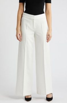 Sharp front pleats create a refined appearance on these wide-leg pants expertly tailored to elevate both in-office and off-duty looks. 31" inseam; 24 1/2" leg opening; 10 3/4" front rise; 15 3/4" back rise Zip fly with hook-and-bar closure 89% polyester, 11% spandex Dry clean Imported Timeless Wide Leg Pants For Workwear In Spring, Spring Wide Leg Tailored Work Pants, Tailored Wide Leg Pants For Spring Workwear, Modern White Wide Leg Pants For Formal Wear, Modern White Wide Leg Pants For Formal Occasions, Chic White Wide Leg Pants For Office, Modern White Formal Wide Leg Pants, Tailored White Wide Leg Pants, Office Wide Leg Pants With Pressed Crease