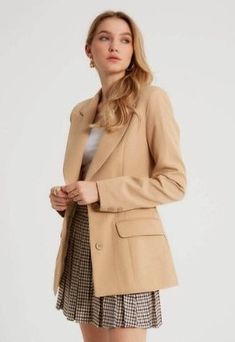 A rockstar blazer meets pure sophistication in this women's designer light camel blazer. This piece has a luxe peak lapel, functional buttoned front and generously padded shoulders that will enhance any outfit. Add this classic piece to your wardrobe revamp for next time you're dressing up for that big promotion at work or heading out on the town Product Features - Pure sophistication written all over it - Comes with luxe peak lapels and functional buttonfront - Padded shoulder adds comfort, sup Trendy Notch Lapel Blazer Dress For Office, Trendy Office Blazer Dress With Notch Lapel, Chic Beige Blazer With Double Button Closure, Beige Fitted Blazer For Workwear, Chic Beige Blazer With Notch Lapel, Trendy Single Breasted Blazer For Office, Fitted Beige Blazer For Work, Trendy Beige Blazer With Lapel Collar, Trendy Beige Business Outerwear