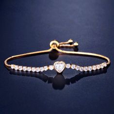 Delicate and elegant, this adjustable heart bracelet will add a touch of sophistication to any wedding gown or formal ensemble. Adorned with heart-shaped cubic zirconia that captures the light from every angle with a perfectly translucent appeal, the bracelet is rhodium / rose gold / yellow gold plated for a flawless finish which perfectly enhances the intricate detailing and conveys a modern take on old elegance. The bracelet measures 0.4" (approx. 1cm) at the widest point, and the adjustable c Crystal Wedding Jewelry, Bridal Bracelet, Crystal Wedding, Matching Necklaces, Heart Bracelet, Heart Jewelry, Silver Rose Gold, Adjustable Bracelet, Gold Yellow