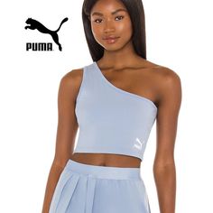 New W Tags Size Women Large Liven Up Your Look With The Puma Classics Asymmetric Bandeau. The Forever Faster Brand Sports A Forever Blue Colorway For This Piece While A Contrast Puma Cat Logo Makes An Appearance At The Front. Take Your Athletic Apparel To The Next Level And Enjoy This Remixed Classic. No Built In Bra! Slim Fit. Asymmetrical Hem Creates A Trendy Appeal. Materials: 93% Cotton, 7% Elastane. Pit To Pit 17" Length 16.5" One Shoulder Athleisure Activewear For Sports, Trendy Blue Sports Crop Top, Trendy Blue Activewear For Spring, Blue Athleisure Sports Bra For Spring, Blue Sports Crop Top For Spring, Blue Crop Top For Sports In Spring, Blue Athleisure, Pink Pumas, Puma Shirts